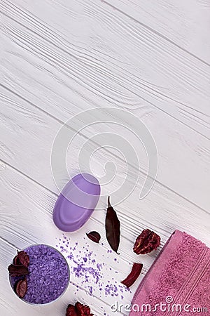 Vertical shot purple bath accessories on white desk. Stock Photo