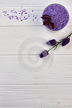 Vertical shot purple salt and flowers for spa treatment. Stock Photo