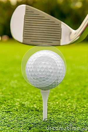 Vertical shot the putter and golf ball Stock Photo