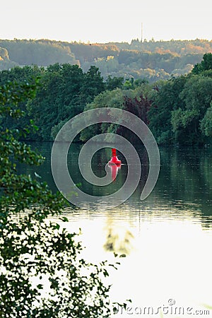 Vertical shot of the red kayak sailing in river Stock Photo
