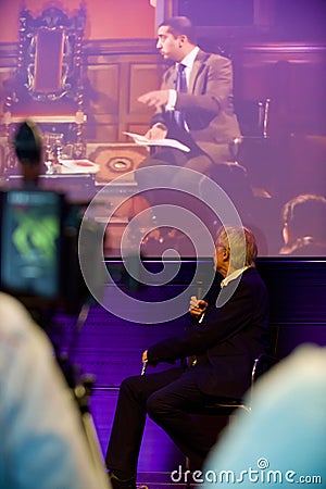 Vertical shot of Richard Dawkins at a conference on Dissent looking at the screen, in Koln, Germany Editorial Stock Photo