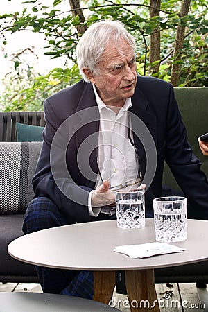 Vertical shot of Richard Dawkins talking during the conference about Dissent in Koln, Germany Editorial Stock Photo