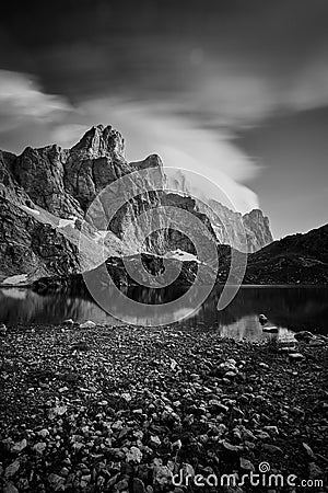 Vertical shot of the rocky mountains reflecting in the lake, Lago Rienza, Italy, Europe Stock Photo