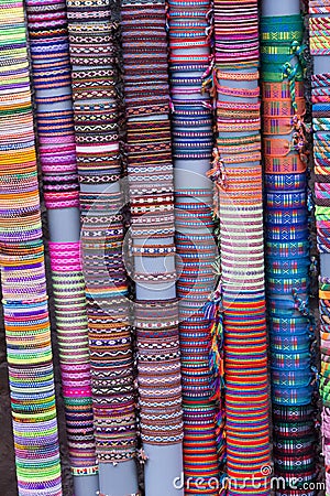 Vertical shot of rows of colorful handmade bracelets Stock Photo