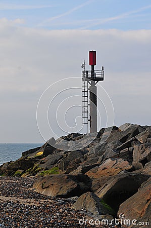 Vertical shot of Sea Palling Beach against a cloudy sky Stock Photo