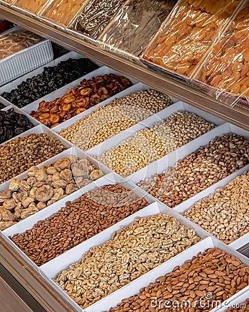 Vertical shot of a selection of dried nuts displayed on a market stall Stock Photo