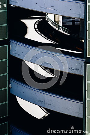 Vertical shot of a spiral ramp in a concrete parking garage Stock Photo