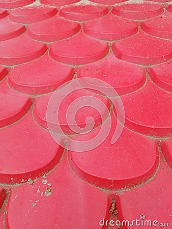 Vertical shot of a surface with red plastic patterned tiles Stock Photo