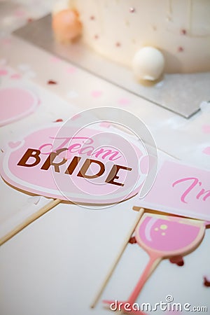 Vertical shot of team bride signs in pink color Stock Photo