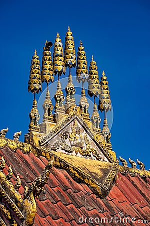 Vertical shot of a temple roof design in Wat Phiawat, Xiangkhouang, Laos Stock Photo