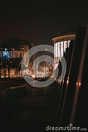 Vertical shot of an urban street in a city and cars in a heavy traffic at night Stock Photo