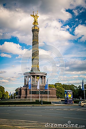 Vertical shot of the Victory Column Monument in Berlin against blue cloudy sky Editorial Stock Photo