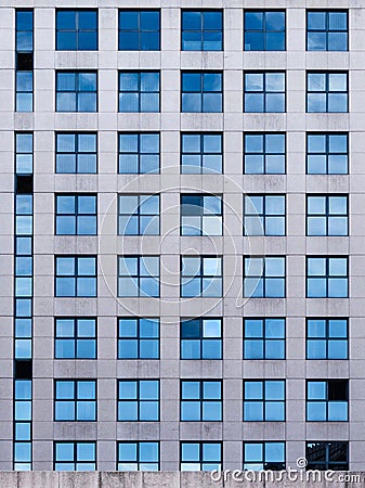 Vertical shot of a windows pattern in a modern building acade Stock Photo