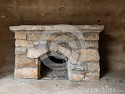 a vertical shot of a wooden fireplace with a white stone wall in the middle of a house Stock Photo