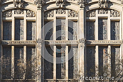 Vertical stained glass windows of the facade of a modernist building Stock Photo