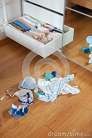 Storage in wardrobe. Preparing for the birth of a child. Stock Photo