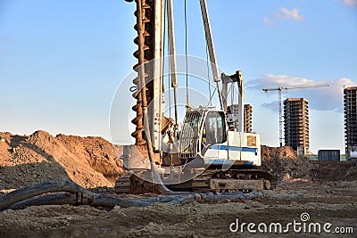 Vertical tamrock pile foundation drilling machine. Drill rig at construction site. Ground Improvement techniques, vibroflotation Editorial Stock Photo