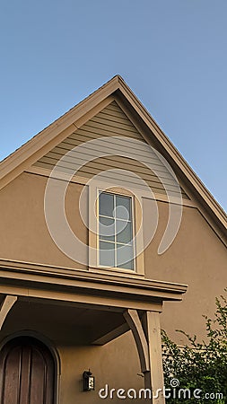 Vertical Top floor window in roof apex on a modern house Stock Photo