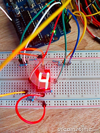 Vertical top view of number four on seven segment display breadboard Stock Photo