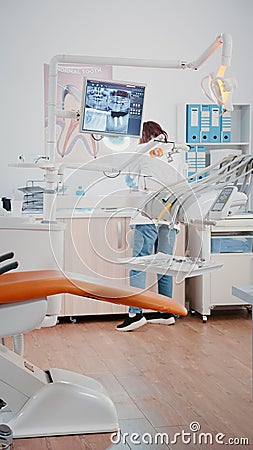 Vertical video: Stomatologist using chair with tools for dental care Stock Photo