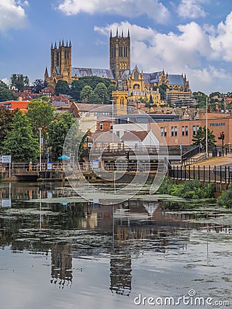 Vertical view of Brayford lake before the Lincoln Cathedral and city buildings of Lincoln Editorial Stock Photo