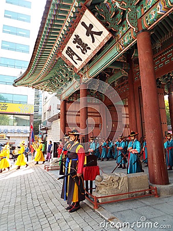 Vertical view of the changing of the Royal Guard ceremony in the entrance courtyard of Deoksugung Palace in Seoul Editorial Stock Photo