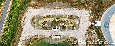 Vertically aerially taken in front basin or stilling basin of a rainwater retention basin in a new development area Stock Photo