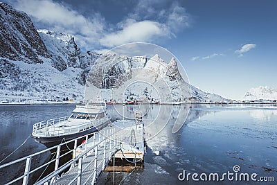 Very beautiful bay in the sea with a fishers boat in Norway on the Lofoten Islands Stock Photo