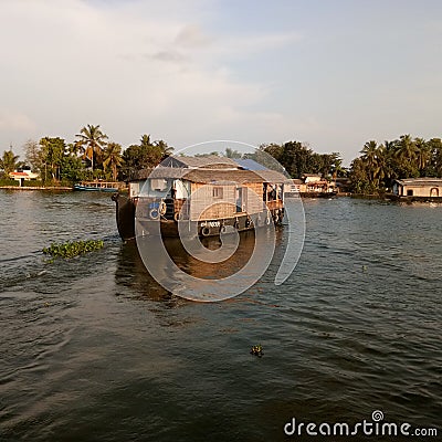 Attractive silent water river with houseboat and trees in kerala Editorial Stock Photo