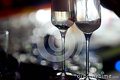 Very close glass of champagne while filling it with a drink Stock Photo