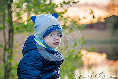 Very cute small toddler boy outdoors Stock Photo