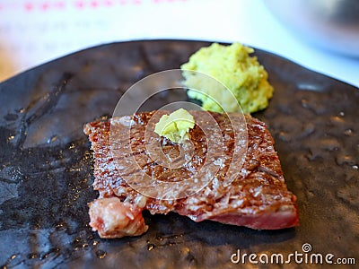 This is a medium-well-broiled beef dish. Koreans eat it with grilled meat and wasabi. Stock Photo