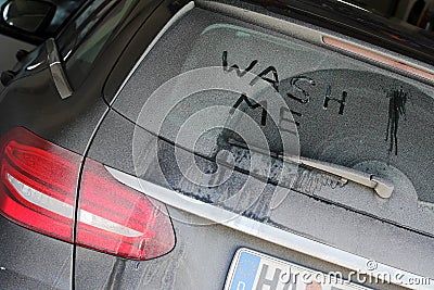 A very dirty car in winter Stock Photo