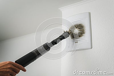 Very dirty and dusty white plastic ventilation grill. Ventilation shaft in the apartment. dirty air filter. Stock Photo