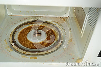 Very dirty inside the microwave oven. Microwave engine failure due to spilled liquid Stock Photo