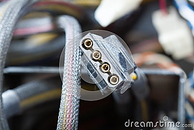 Very dirty wires, connectors and plugs in the computer. Old multi-colored wires in a braided wrapper. Stranded electrical wire Stock Photo