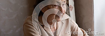 Very elderly woman happily holding a laptop Stock Photo