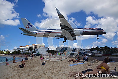 emotional low landing of plane over Maho beach, Saint Martin , Caribbean islands Editorial Stock Photo