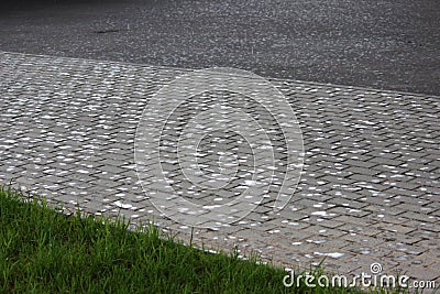 the very first drops of rain on the sidewalk tile. the beginning of a summer shower Stock Photo