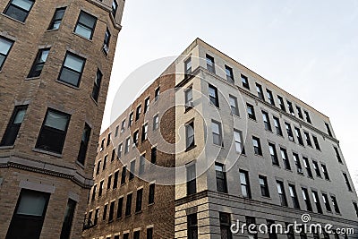 Very generic urban brick apartment buildings with rows of windows, urban cityscape Stock Photo