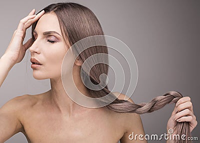 Very gentle portrait of a sexy woman with long purple hair Stock Photo