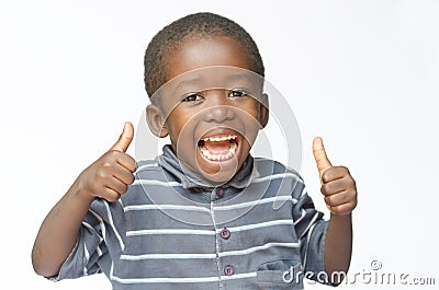 Very happy African black boy making thumbs up sign with hands laughing happily African ethnicity black boy isolated on white Stock Photo