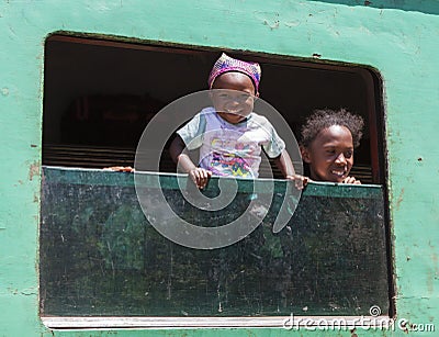 Very happy baby with a young African girl Editorial Stock Photo