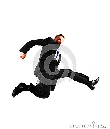 Very happy energetic businessman jumping into the Stock Photo