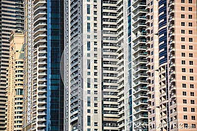 Very high skyscrapers close up of windows and balcony`s of crowded residential buildings Stock Photo