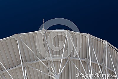 Very Large Array structure under a large radio telescope antenna dish at the VLA in New Mexico Stock Photo