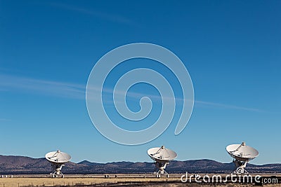 Very Large Array three very large radio telescope dishes in the New Mexico desert, winter Stock Photo