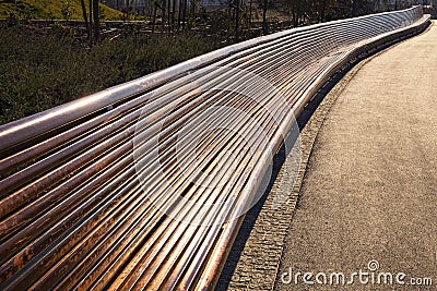 Very long empty wooden bench Stock Photo