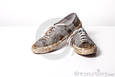 Very Muddy Trainers white shoes on white Stock Photo