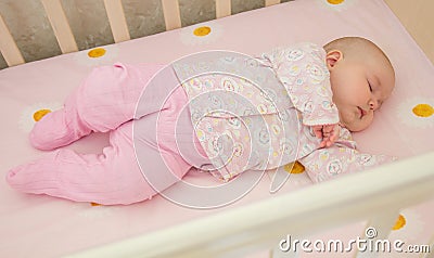 Very nice sweet baby sleeping in crib Stock Photo